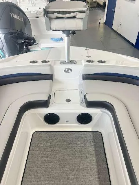 Slide: The Image of 2024 Hurricane 218 SS boat interior with seating and Yamaha engine. - 6