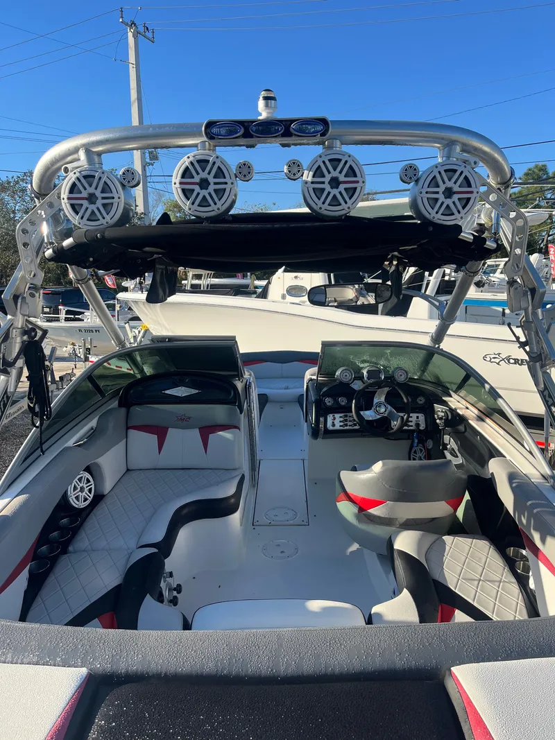 Slide: The Image of 2009 MasterCraft MariStar 230 boat interior with wakeboard tower and speakers. - 11