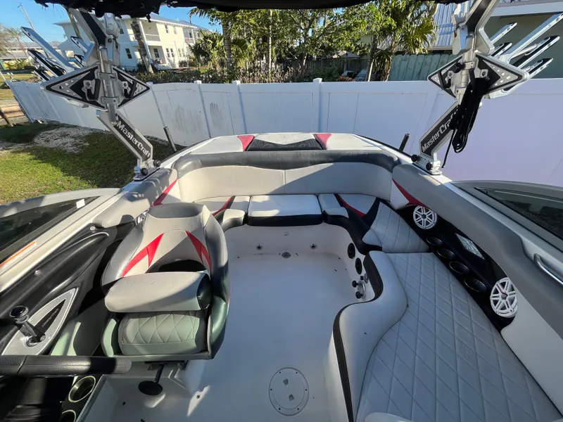 Slide: The Image of 2009 MasterCraft MariStar 230 boat interior with seating and speakers. - 18