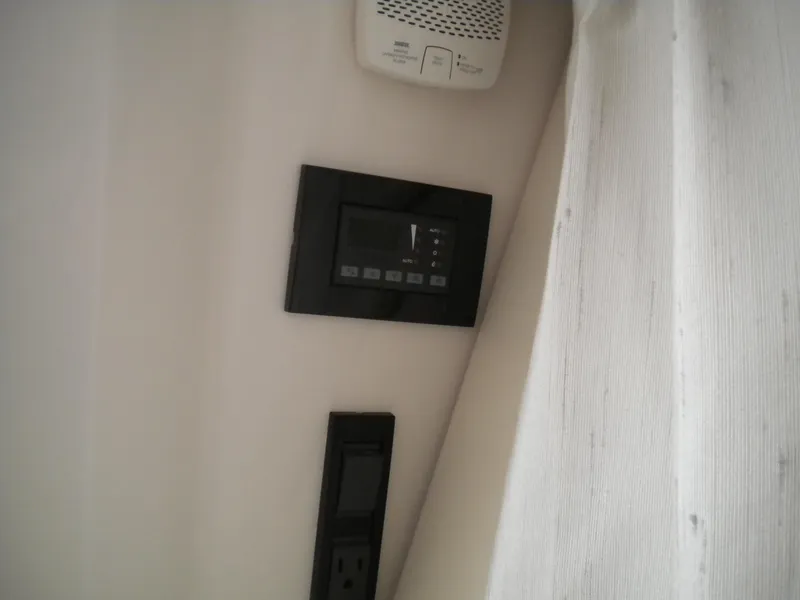 Slide: The Image of Control panel and outlet on 2018 Regal 3300 Bow Rider boat interior. - 24