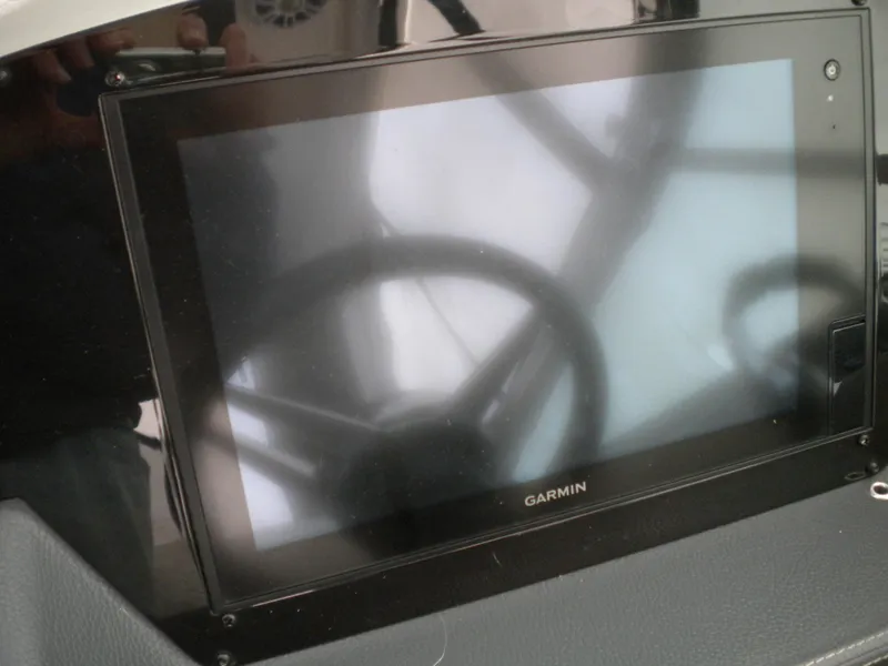 Slide: The Image of Garmin display on 2018 Regal 3300 Bow Rider boat dashboard. - 25