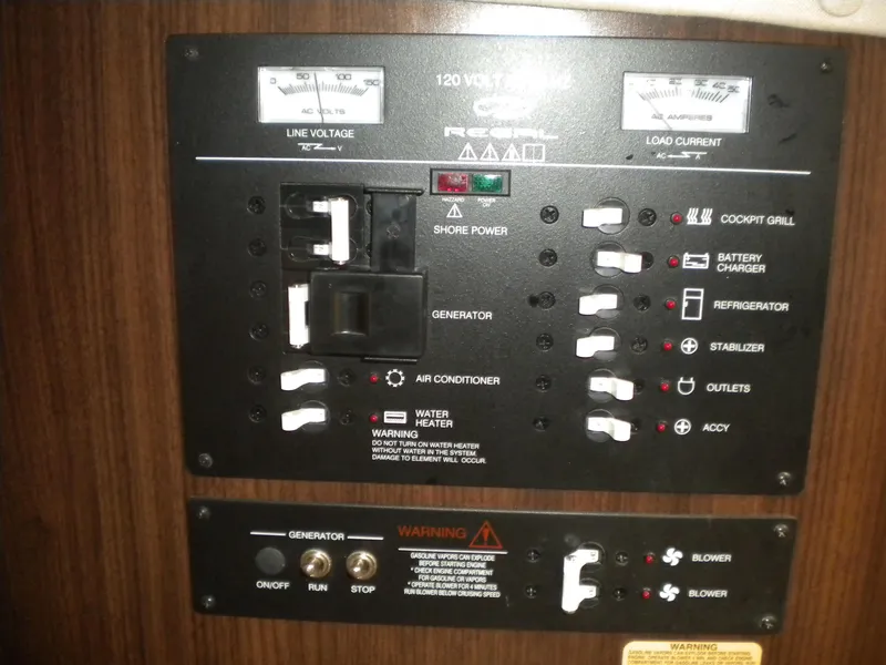 Slide: The Image of Control panel of a 2018 Regal 3300 Bow Rider boat with various switches and indicators. - 29