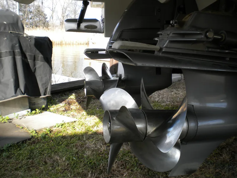 Slide: The Image of Propellers of a 2018 Regal 3300 Bow Rider boat near water. - 36
