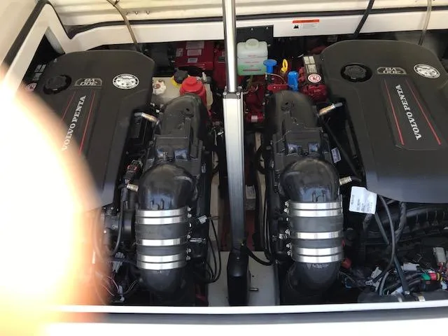 Slide: The Image of 2018 Regal 3300 Bow Rider engine compartment with dual Volvo Penta engines. - 38