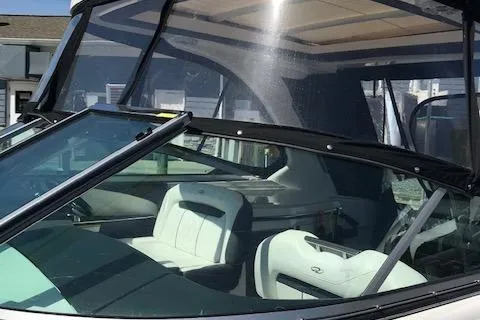 Slide: The Image of 2018 Regal 3300 Bow Rider boat interior with white seating and windshield. - 40