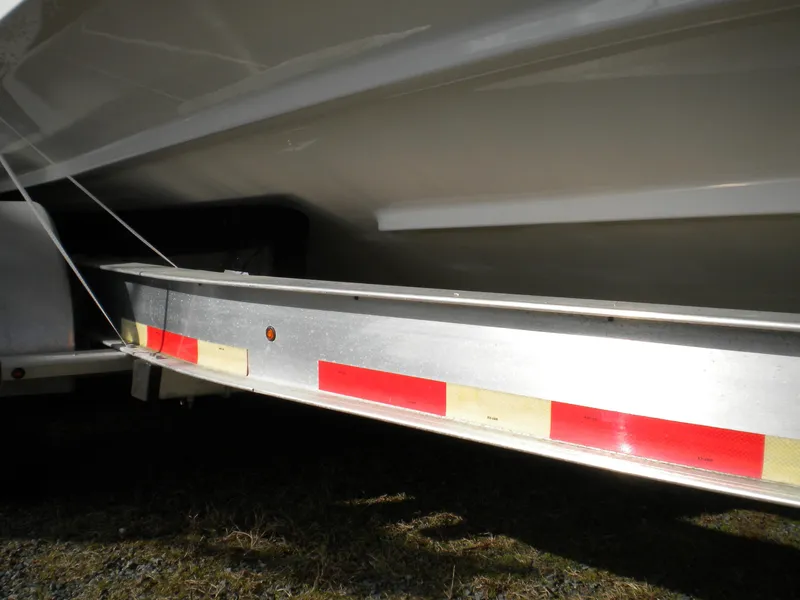 Slide: The Image of 2018 Regal 3300 Bow Rider on trailer, close-up view of hull and trailer. - 45
