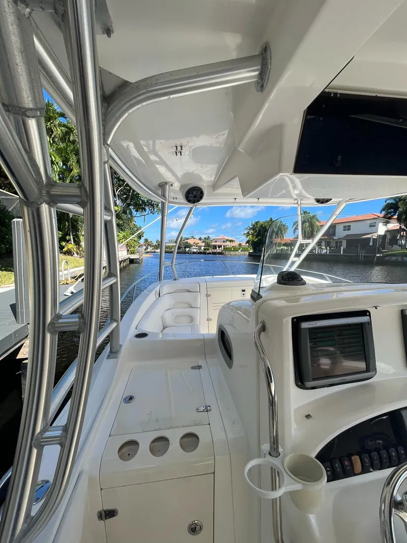 Slide: The Image of 2006 Boston Whaler 320 Outrage Cuddy Cabin, sleek design, spacious deck, modern controls. - 14