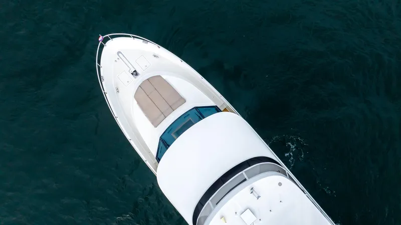 Slide: The Image of Top view of 2018 Ocean Alexander 85 E yacht on deep blue water. - 1