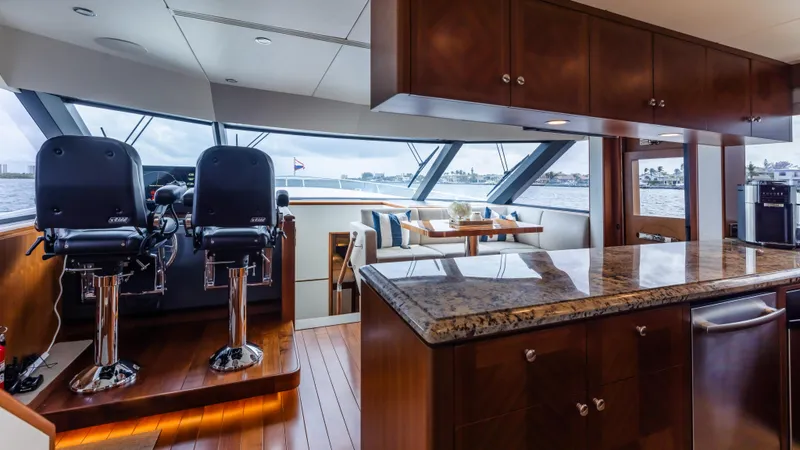 Slide: The Image of Luxurious interior of 2018 Ocean Alexander 85 E yacht with modern helm and dining area. - 17