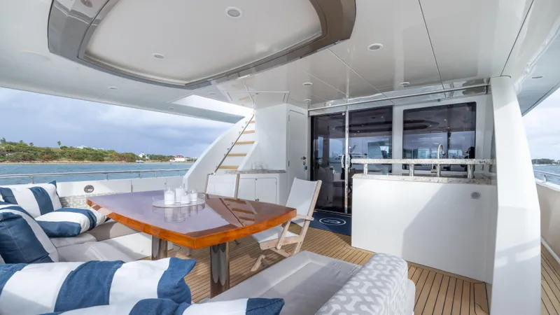 Slide: The Image of Luxurious 2018 Ocean Alexander 85 E yacht deck with elegant seating and dining area. - 20