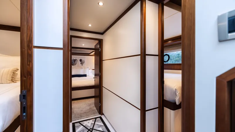 Slide: The Image of Luxurious interior hallway of 2018 Ocean Alexander 85 E yacht with elegant wood accents. - 21