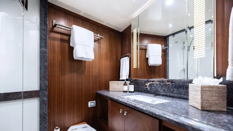 Slide: The Image of Luxurious bathroom in 2018 Ocean Alexander 85 E yacht with elegant wood paneling. - 24