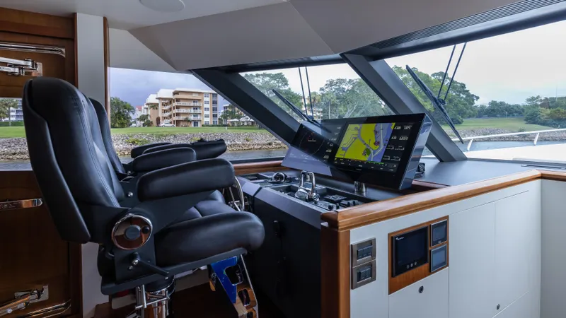 Slide: The Image of Pilothouse of 2018 Ocean Alexander 85 E yacht with navigation equipment and leather chairs. - 25