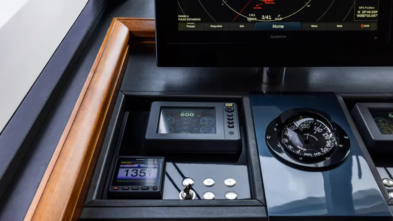 Slide: The Image of Control panel of 2018 Ocean Alexander 85 E yacht with navigation instruments and displays. - 28