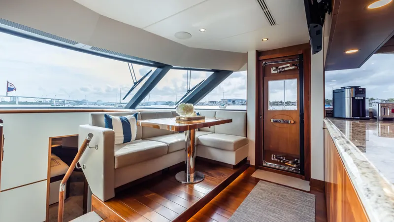 Slide: The Image of Luxurious interior of 2018 Ocean Alexander 85 E yacht with elegant seating and panoramic windows. - 29