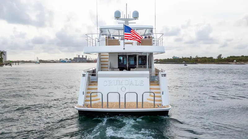 Slide: The Image of 2018 Ocean Alexander 85 E yacht on water, rear view with American flag. - 3