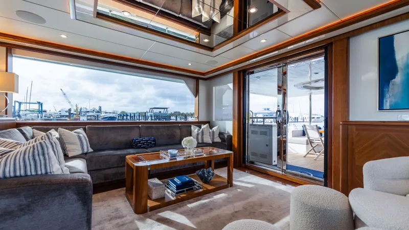Slide: The Image of Luxurious interior of 2018 Ocean Alexander 85 E yacht with elegant furnishings and marina view. - 34