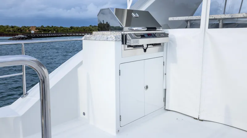 Slide: The Image of Outdoor grill on 2018 Ocean Alexander 85 E yacht deck, overlooking water. - 39