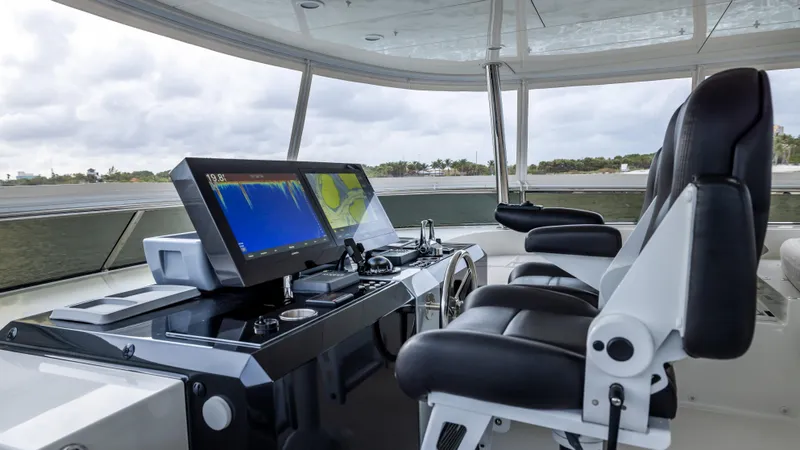 Slide: The Image of Pilothouse of 2018 Ocean Alexander 85 E yacht with modern navigation equipment and seating. - 41