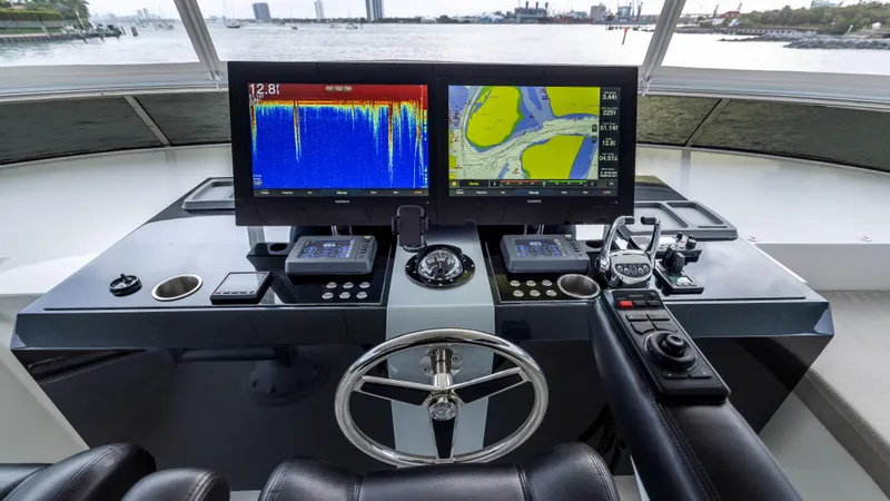 Slide: The Image of Helm of 2018 Ocean Alexander 85 E yacht with navigation screens and controls. - 42