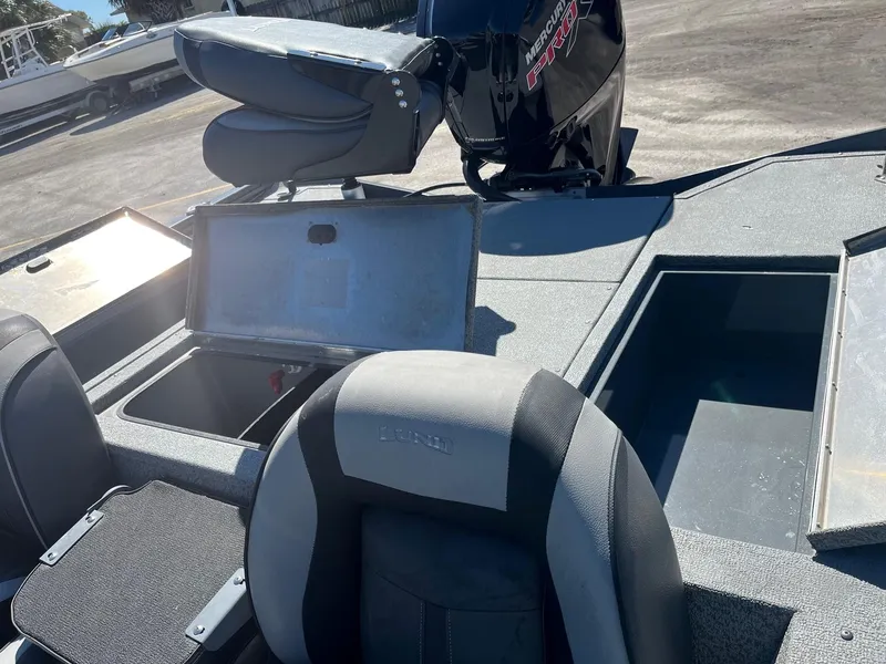 Slide: The Image of 2020 Lund 1875 Predator boat interior with storage compartments and seating. - 5