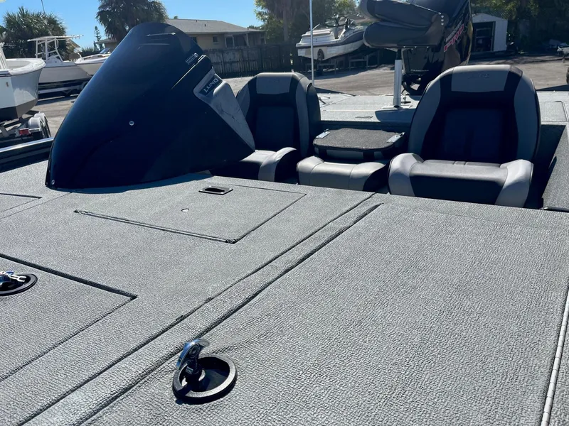 Slide: The Image of 2020 Lund 1875 Predator boat interior with seating and storage compartments. - 6