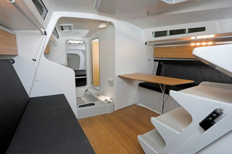 Slide: The Image of Modern interior of 2024 M.A.T. 1220 sailboat with sleek design and wooden accents. - 11