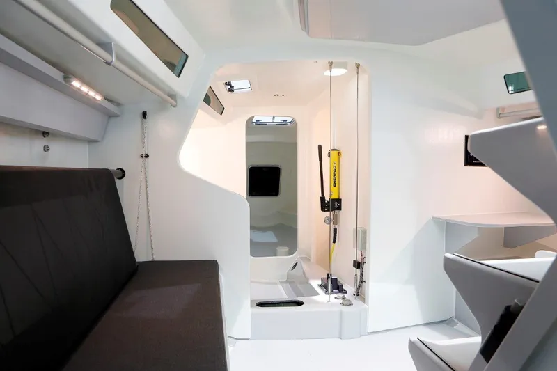 Slide: The Image of Interior of 2024 M.A.T. 1220 sailboat with modern design and seating area. - 6