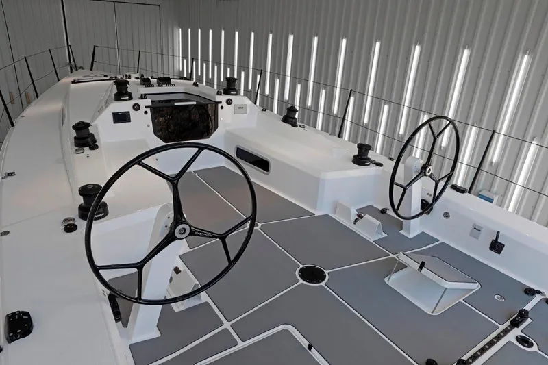 Slide: The Image of M.A.T. 1220 sailboat cockpit, dual steering wheels, modern design, 2024 model. - 8
