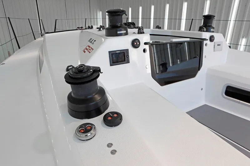 Slide: The Image of 2024 M.A.T. 1220 yacht cockpit with modern controls and winches. - 9
