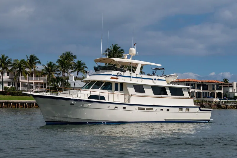 Slide: The Image of 1986 Hatteras 72 Motor Yacht cruising on a sunny day. - 2