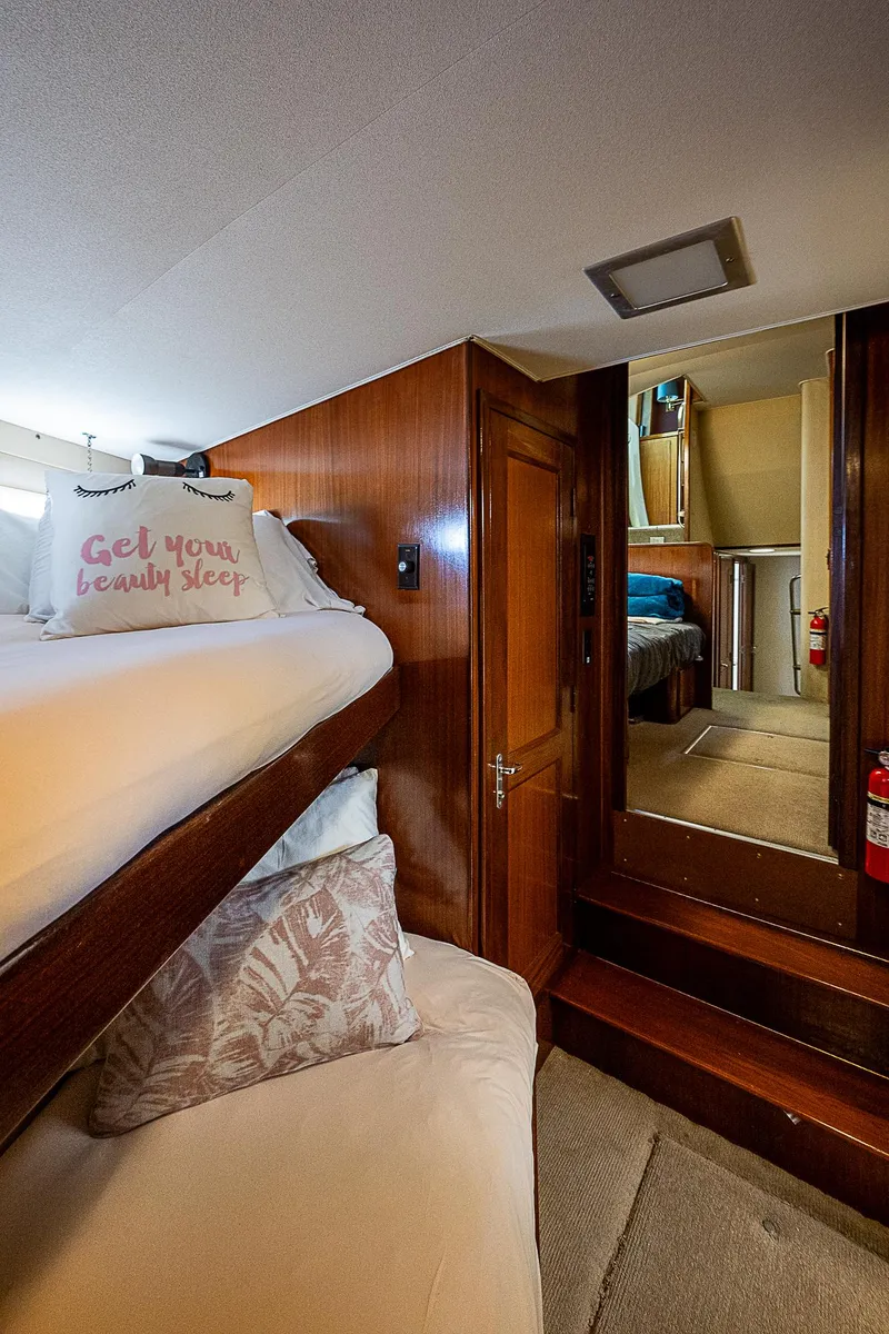 Slide: The Image of Interior cabin of 1986 Hatteras 72 Motor Yacht with cozy bedding. - 38