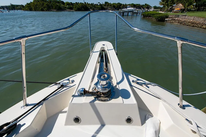 Slide: The Image of Bow view of 1986 Hatteras 72 Motor Yacht on calm waters. - 4