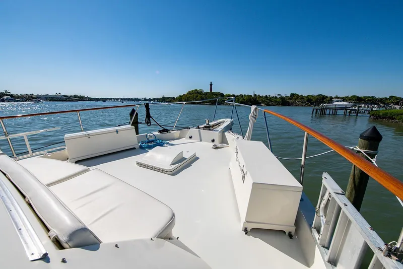 Slide: The Image of 1986 Hatteras 72 Motor Yacht deck with scenic water view. - 5