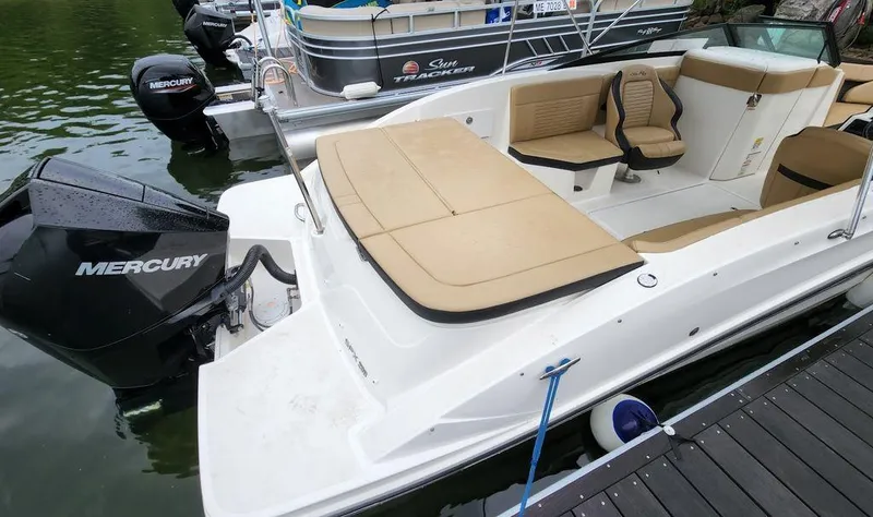 Slide: The Image of 2021 Sea Ray 230 SPXO boat with Mercury outboard engine docked. - 3