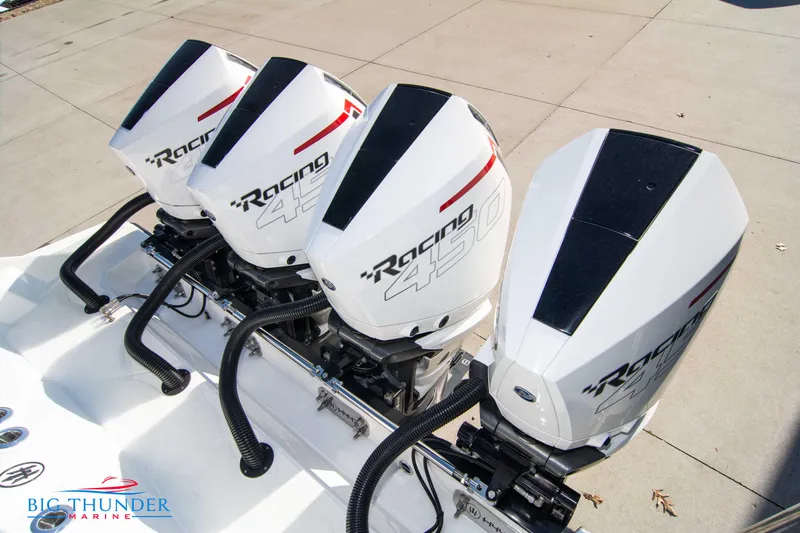 Slide: The Image of Four powerful outboard engines on a 2023 Hayaari Marine H44Z boat. - 12