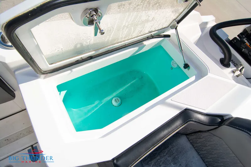 Slide: The Image of Hayaari Marine H44Z 2023 model livewell with open lid and blue water. - 19