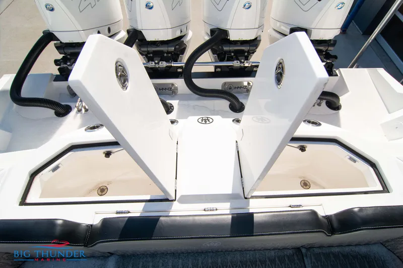 Slide: The Image of 2023 Hayaari Marine H44Z boat with open storage compartments and powerful engines. - 20