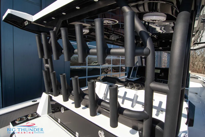 Slide: The Image of 2023 Hayaari Marine H44Z boat with rod holders and Big Thunder Marine logo. - 26