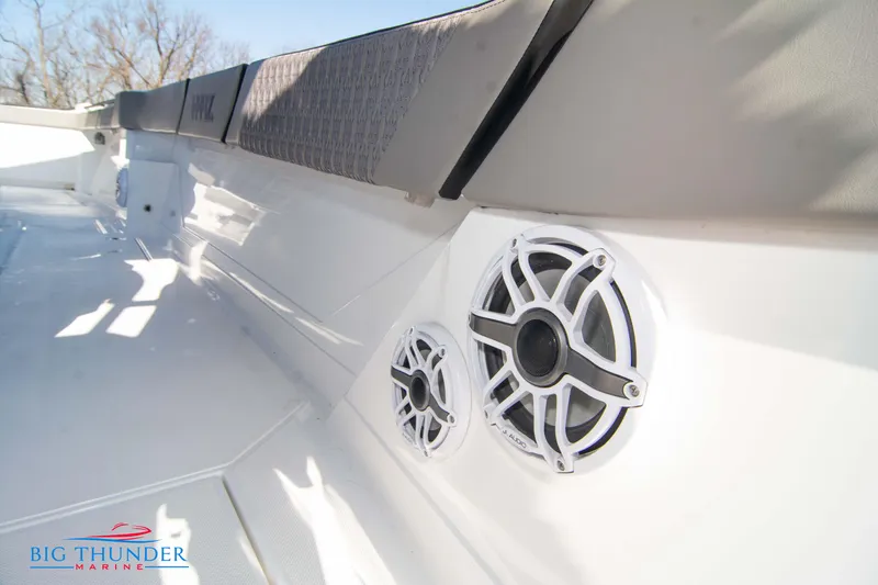 Slide: The Image of 2023 Hayaari Marine H44Z boat interior with speakers and seating, Big Thunder Marine logo. - 36