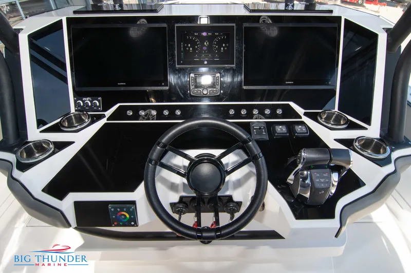 Slide: The Image of Hayaari Marine H44Z 2023 model boat dashboard with steering wheel and control panels. - 41