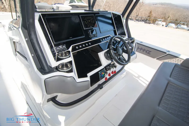 Slide: The Image of Hayaari Marine H44Z 2023 model boat dashboard with advanced navigation systems and steering wheel. - 42