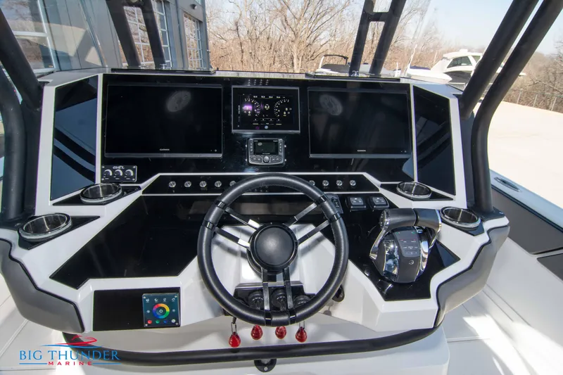 Slide: The Image of 2023 Hayaari Marine H44Z boat dashboard with advanced navigation screens and controls. - 44