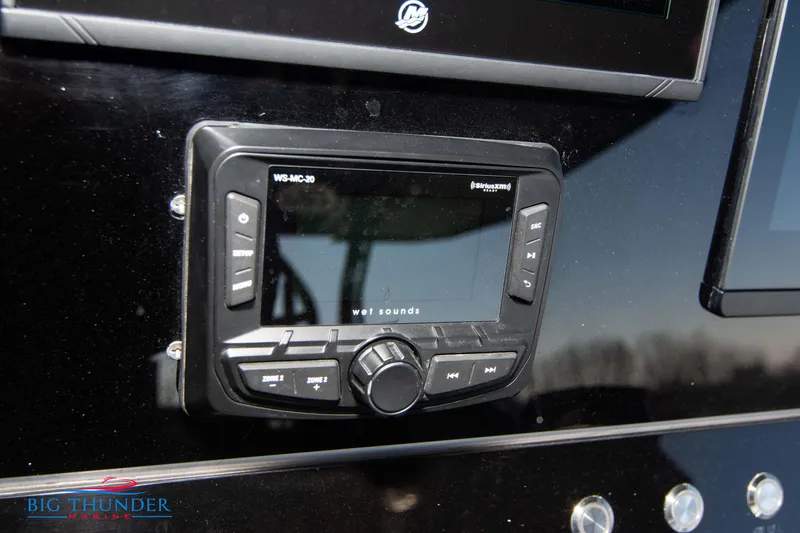 Slide: The Image of Close-up of 2023 Hayaari Marine H44Z dashboard with audio control panel. - 49