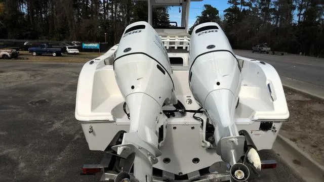 Slide: The Image of 2024 Sea Pro 262 Sport boat with twin outboard engines, rear view. - 3
