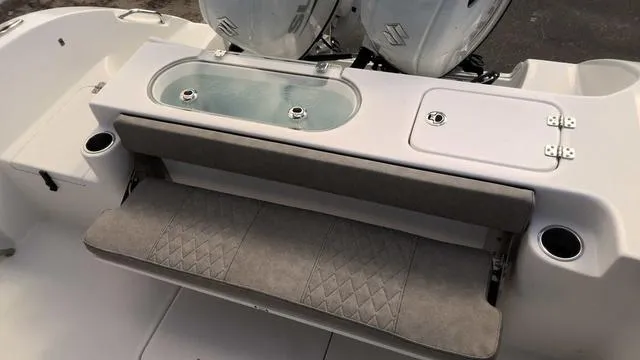 Slide: The Image of 2024 Sea Pro 262 Sport boat with cushioned seating and livewell. - 4