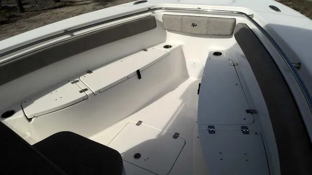 Slide: The Image of 2024 Sea Pro 262 Sport boat interior with seating and storage compartments. - 8