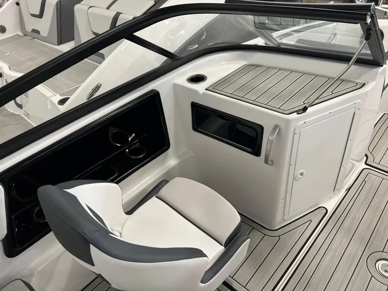 Slide: The Image of 2024 Yamaha Boats 195 S interior cockpit with seating and storage compartments. - 4