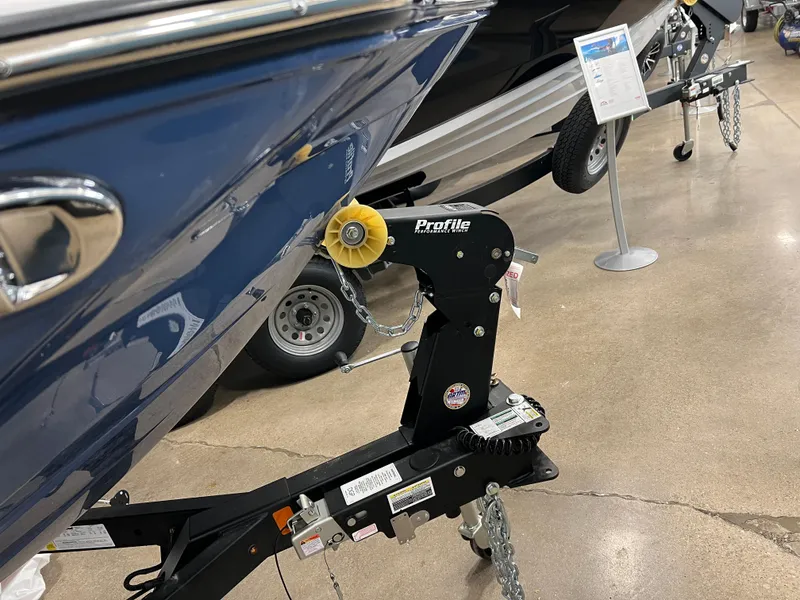 Slide: The Image of 2024 Yamaha Boats 195 S on trailer, close-up view of bow and hitch. - 8