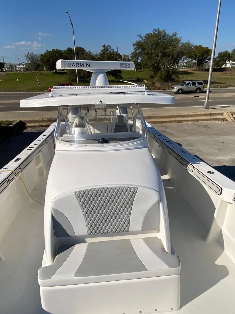 Slide: The Image of 2021 Twin Vee 36 Center Console boat with Garmin equipment, docked on a sunny day. - 22